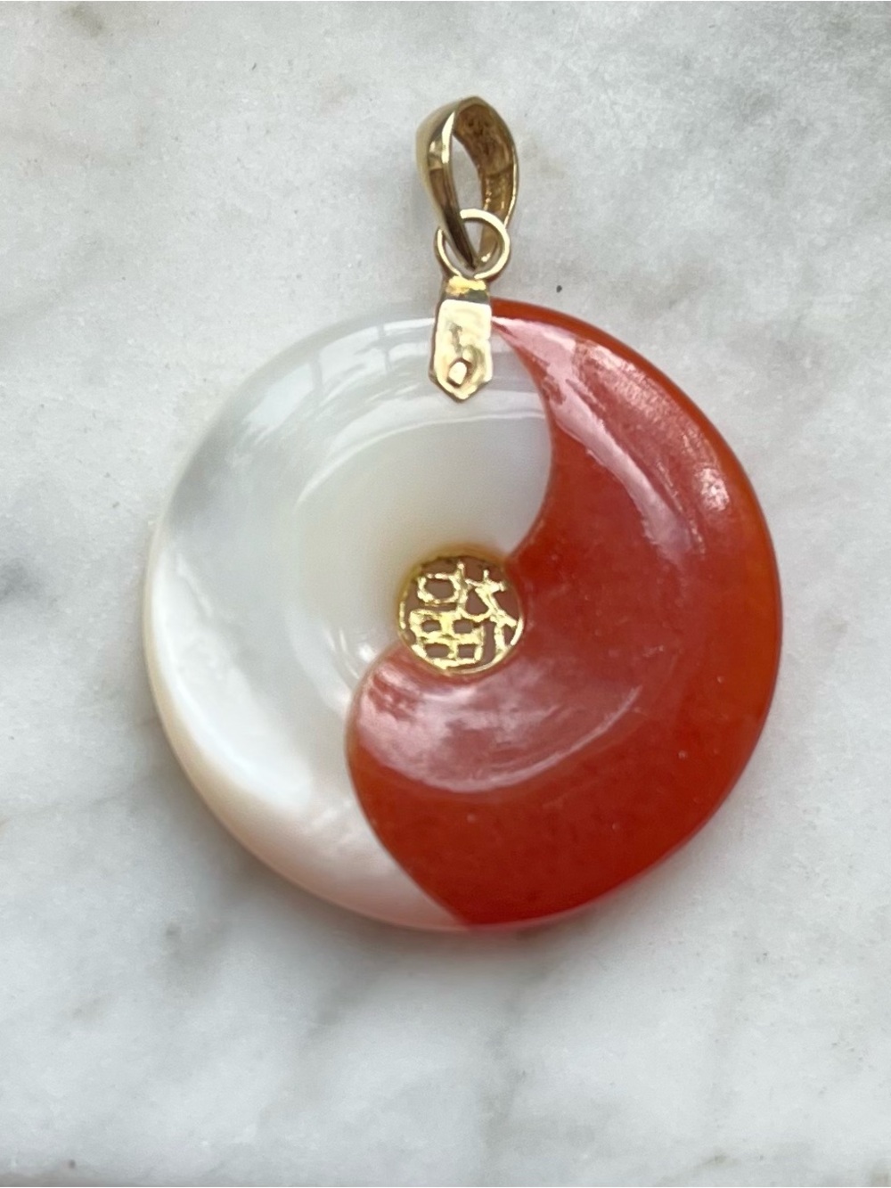 Red and White Yin Yang jadeite/mother of pearl Pendant.  Gold accents and bail .